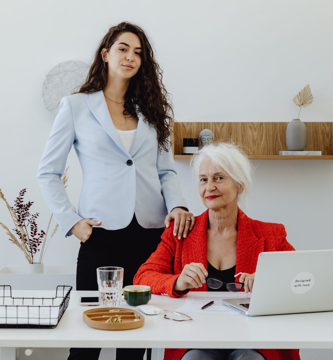 A business owner and the person who could take over, side by side